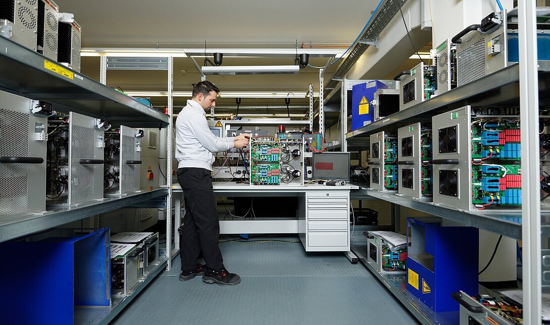Image of an employee in electronic assembly