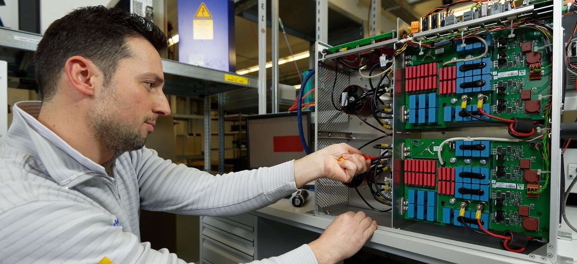 Electronics development employees at work